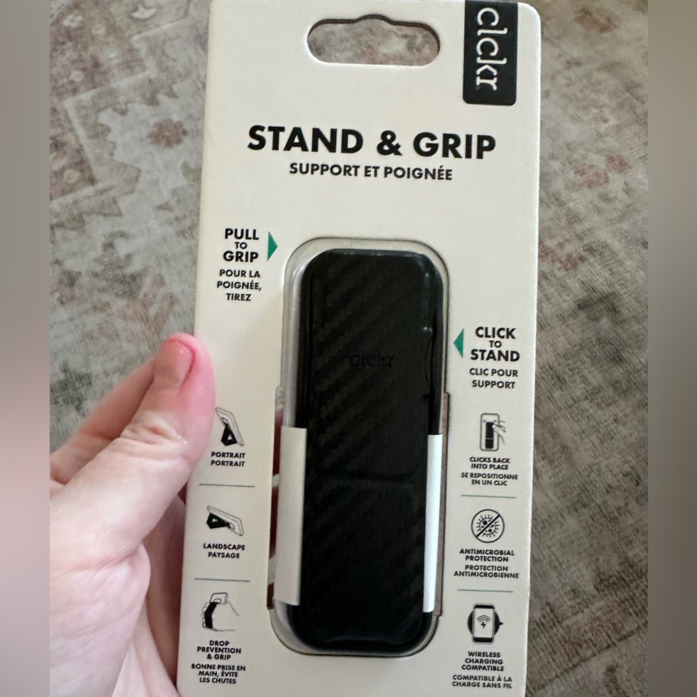 Grip and stand phone accessory. Black. New in box. Originally $15.